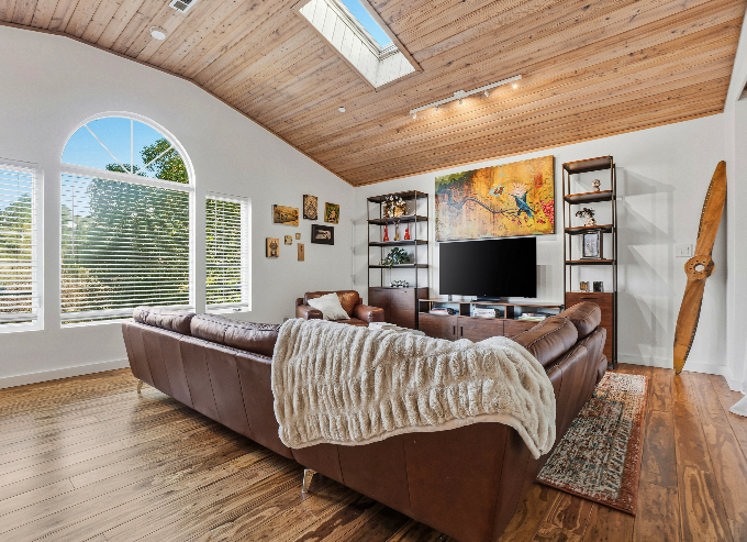 Living room with vaulted wood ceiling